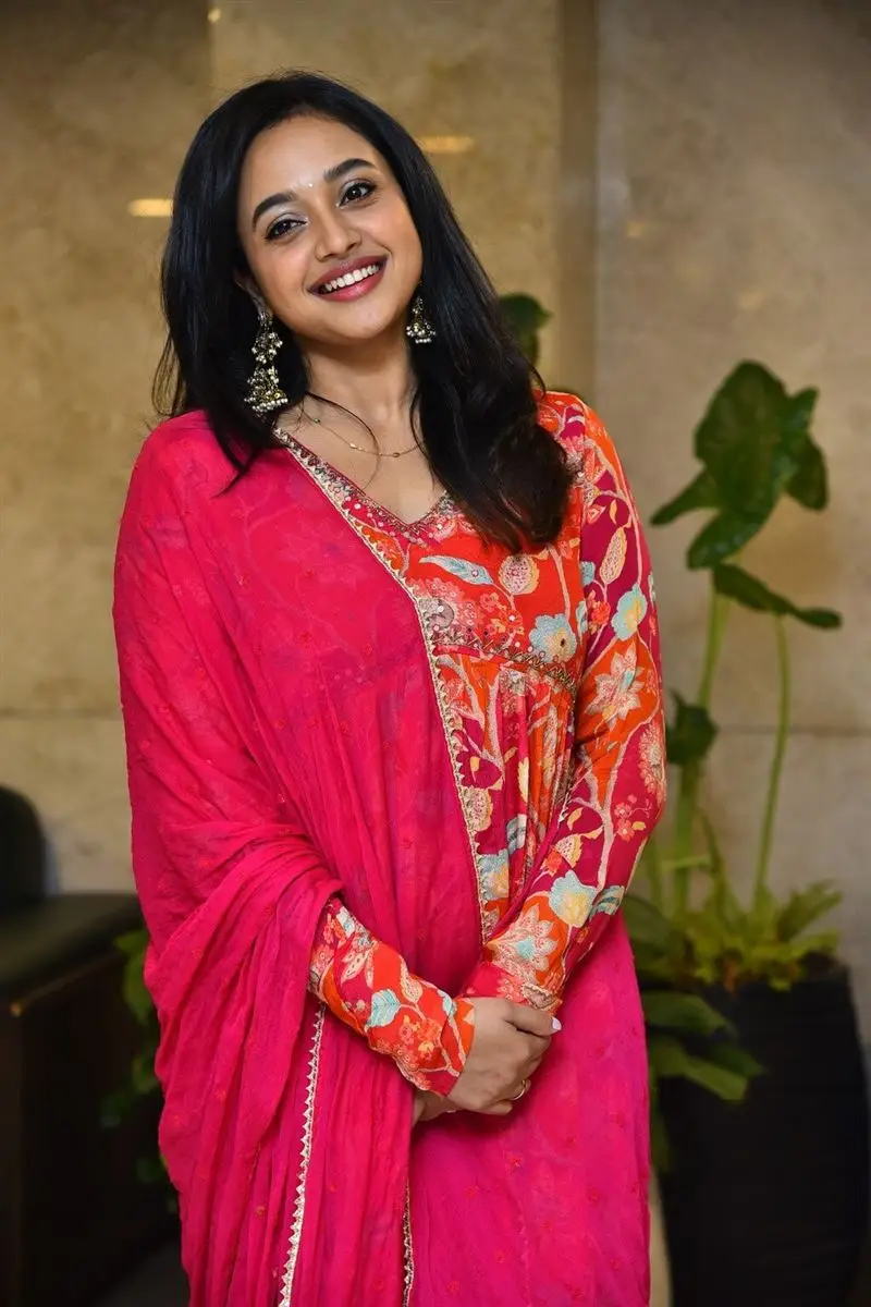 Telugu Girl Yasha Shivakumar in Orange Dress